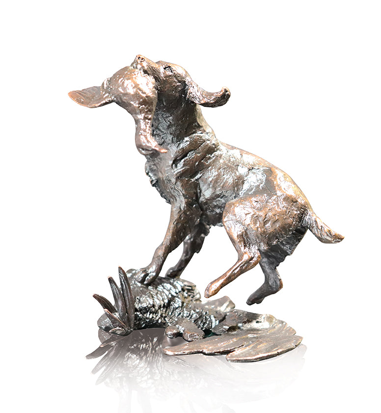 Springer spaniel retrieving mallard by river bronze sculpture