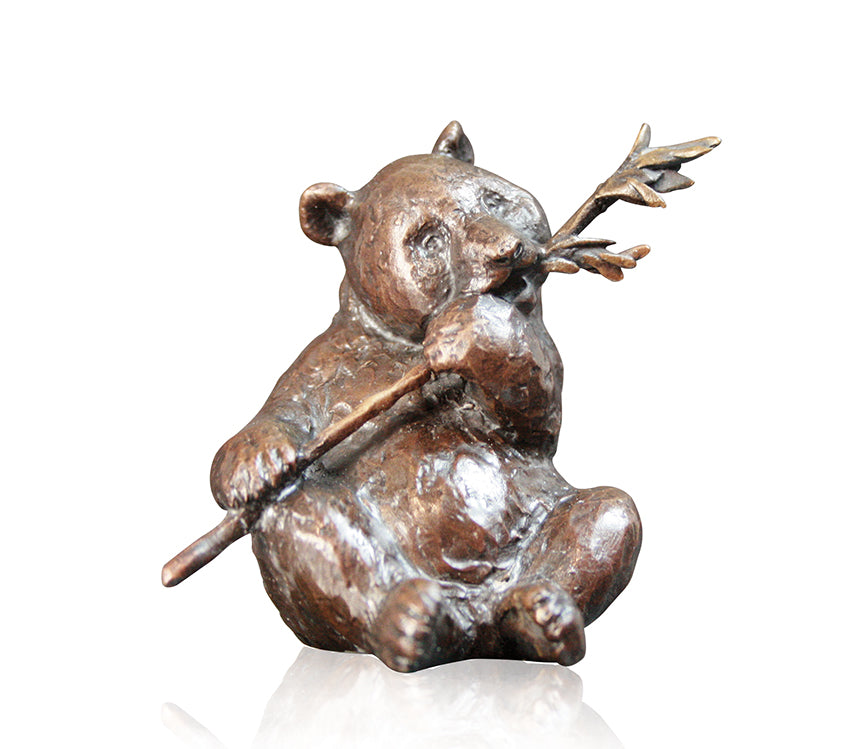 bronze sculpture panda sitting eating bamboo