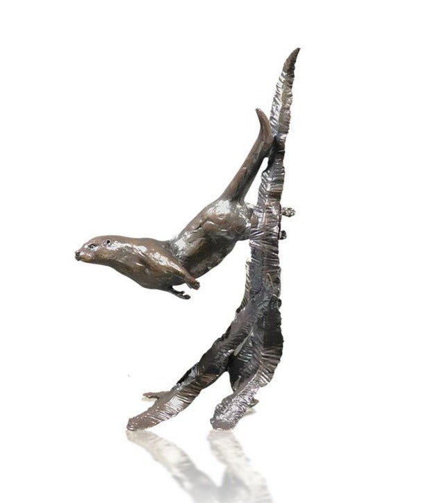 bronze otter swimming through reeds sculpture