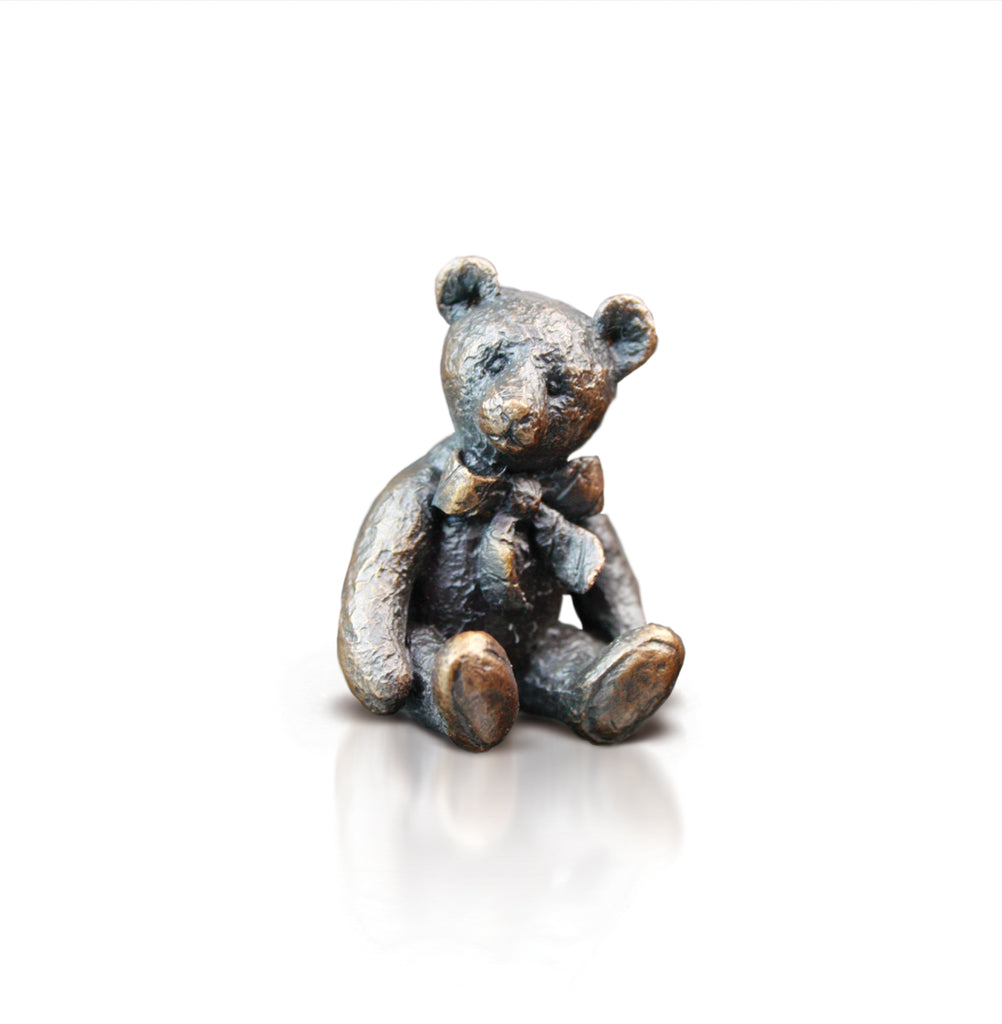 bronze bear with big bow sculpture