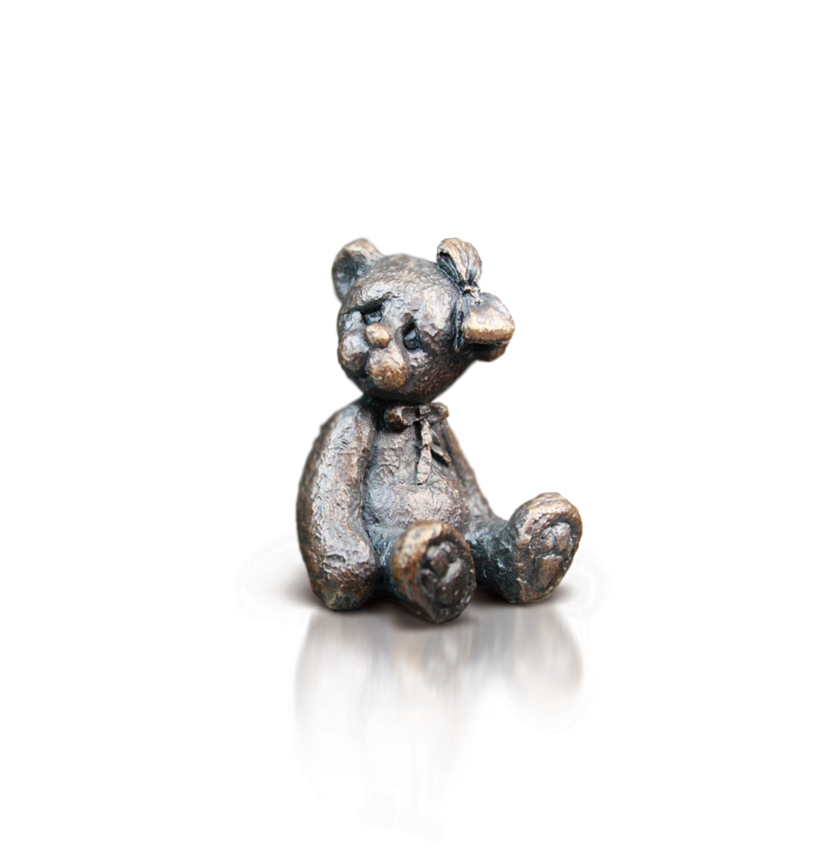bronze bear with bow in hair sculpture