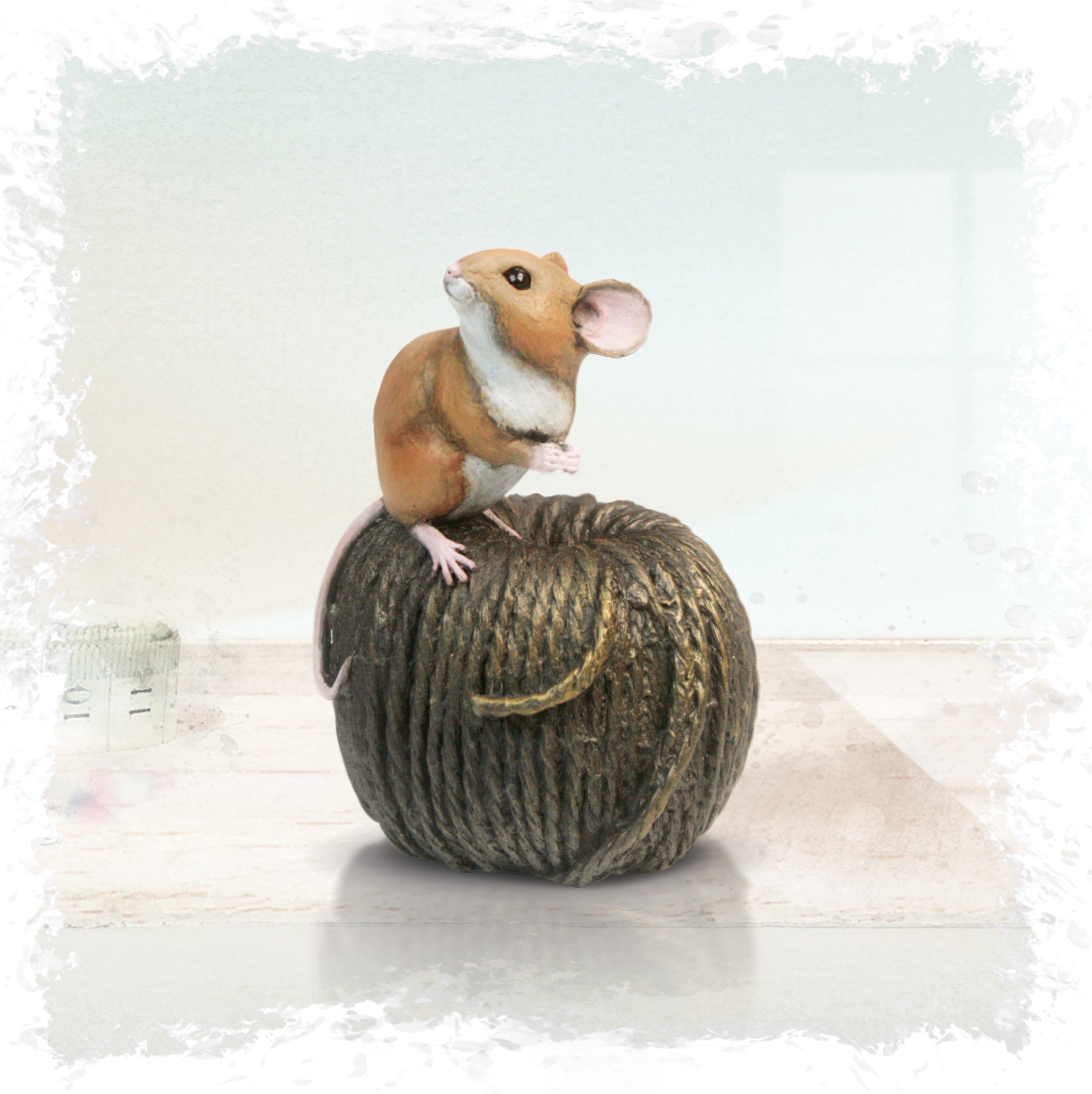 hand painted bronze mouse on twine sculpture